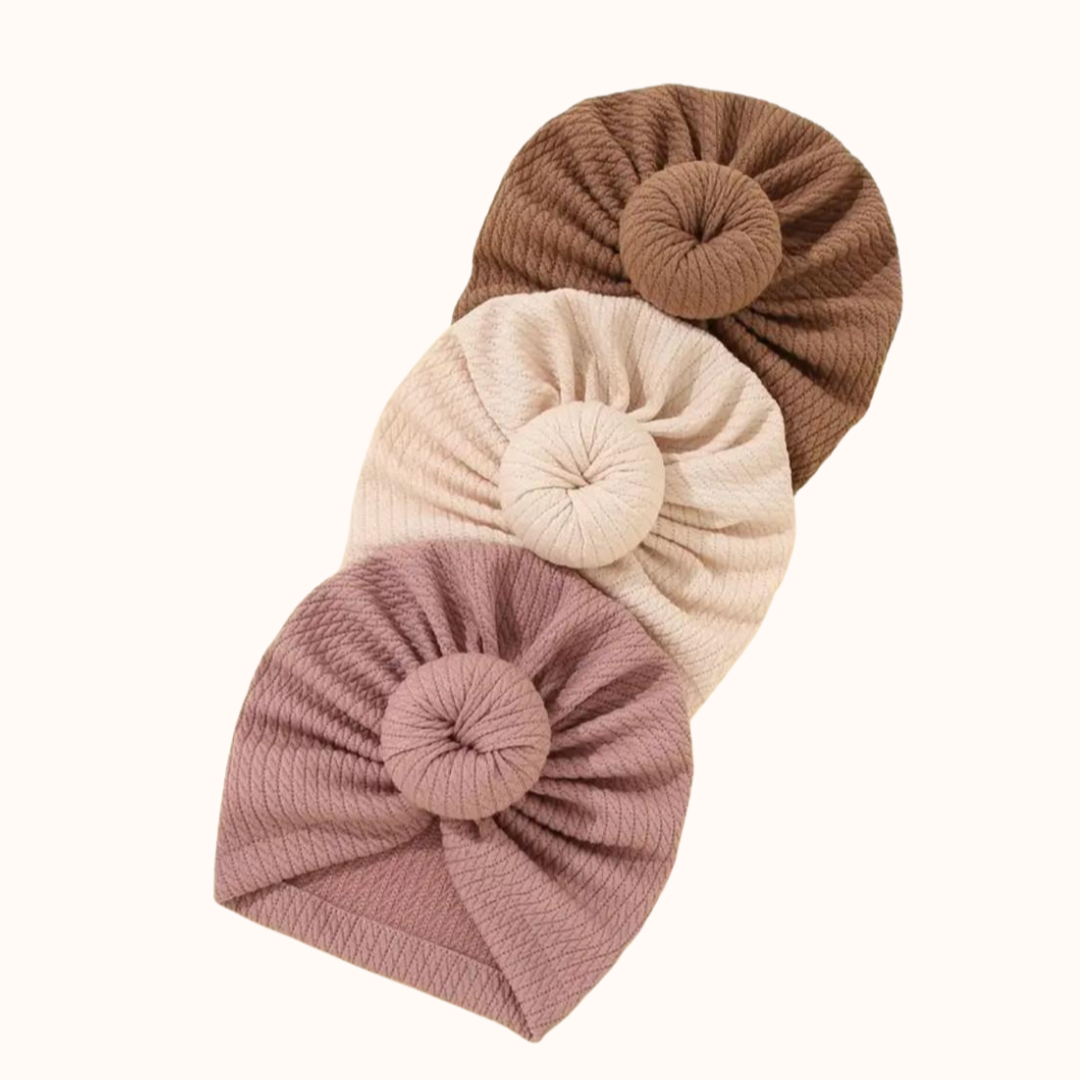 Baby tulband/hoofdband/mutsje, maat 0 - 6 maanden. In de kleuren bruin, beige en roze.